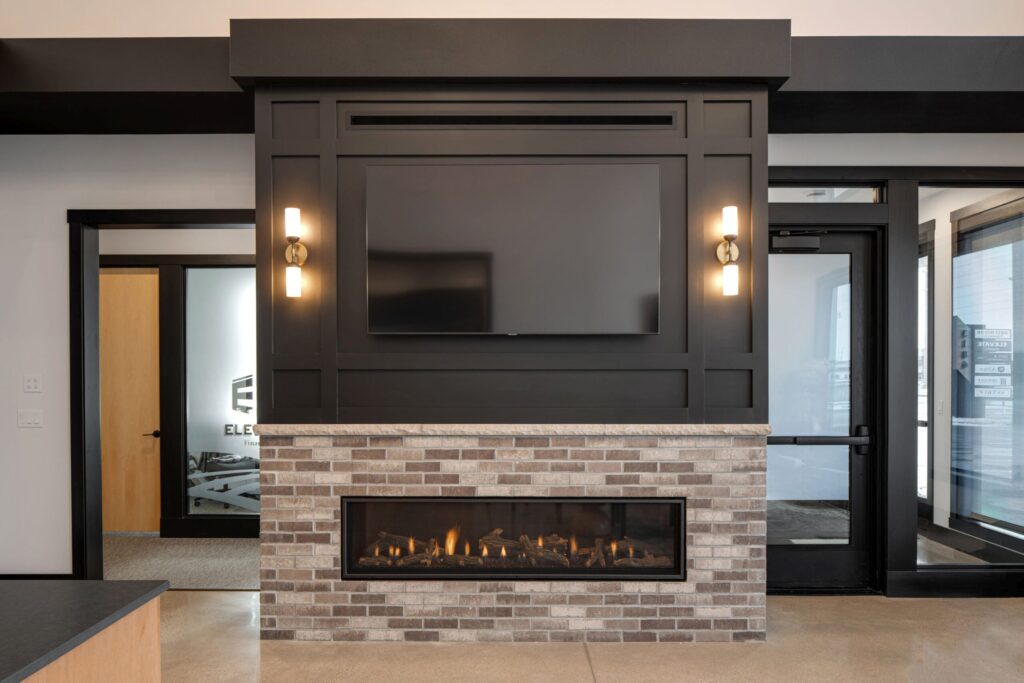Modern financial office interior featuring a fireplace, TV, and stylish design elements. Elegant and professional space.